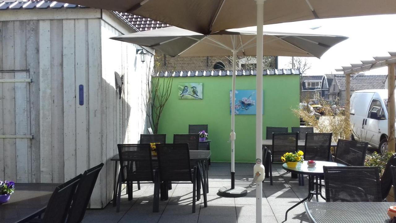 Eetcafe/Pension Nooitgedacht Strijen Esterno foto