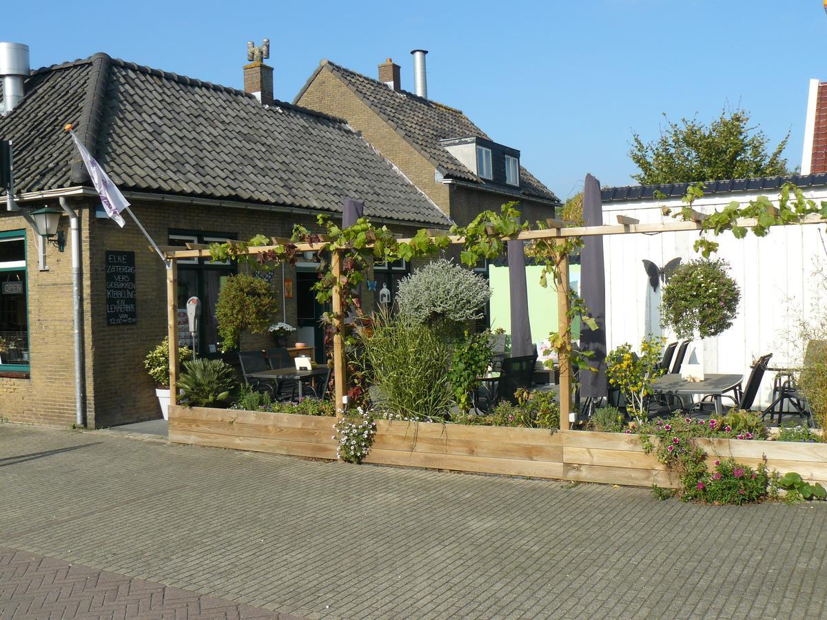 Eetcafe/Pension Nooitgedacht Strijen Esterno foto